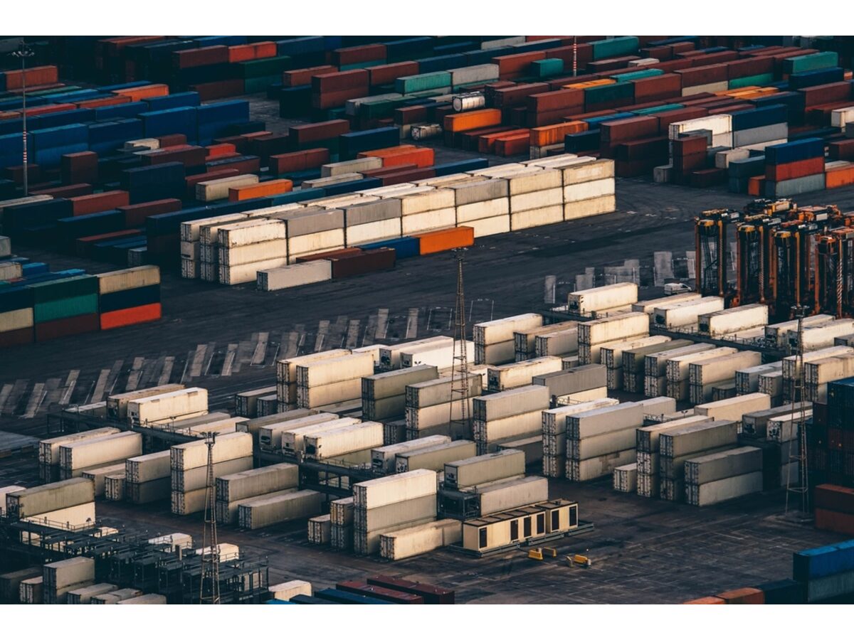 Aerial view of stacked shipping containers at a freight terminal